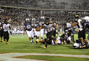 Terrance West ran for 161 yards and scored two touchdowns against UConn in the Tigers' victory