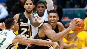 TU guard Mike Burwell and forward Jerrelle Benimon in play against Drexel