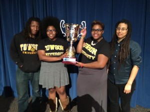CEDA National Debate Champions holding championship cup Ameena Ruffin and Korey Johnson with Towson University debate team coaches Ignacio Evans, left and Amber Kelsie, right.