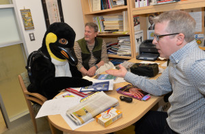 Tux the Penguin, looking for some summer classes, gets some advice from International Studies Program Director Matthew Durington