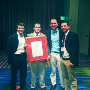 Members of the Towson Chapter of Theta Chi fraternity hold up the Howard R. Alter, Jr., Award for Chapter Excellence at the national convention in Minneapolis. Members include from left, Kevin Kutner, Jeff Cusick, Taylor Sevik and Ian O'Brien. 