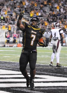 Darius Victor celebrates one of his three touchdowns in Saturday night's win. (Photo courtesy of The Towerlight)