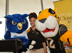 TU in Northeastern Maryland junior Brittany Martin with the HCC Owl and Doc at the grand opening