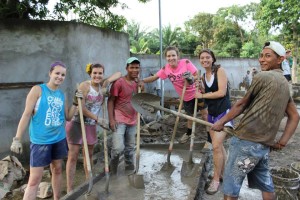 Members of TU's Student Helping Honduras work with local Hondurans to break ground on a girls' transitional home in Villa de Soleada.