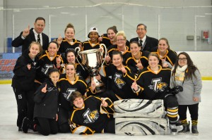 The Towson women's ice hockey team pose after defeating Navy in the Delaware Valley Collegiate Hockey Conference Division I championship game. 