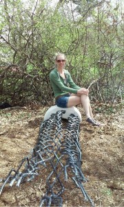 Sculptor Jessie Greenwell with Journey, steel braided sculpture at the University of Delaware Art in the Garden.