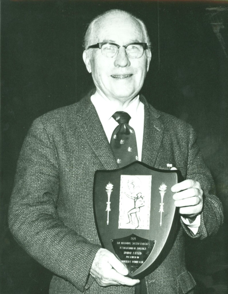 Donald "Doc" Minnegan with his 1971 award from the NSCAA.