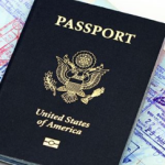 A US passport laying on a world map
